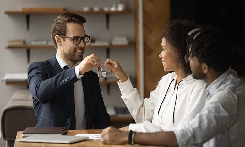 Renter receiving keys from a real estate professional